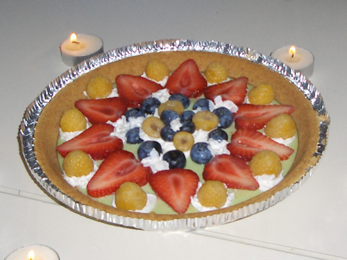 Key lime birthday pie covered in "exotic" fruits