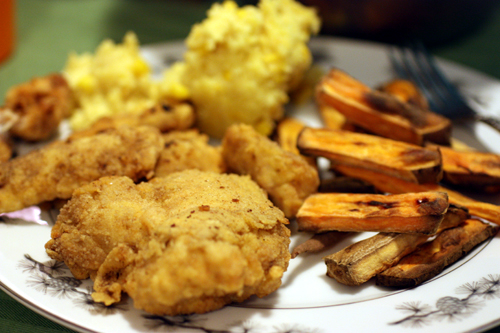 Fried chicken, corn pudding and sweet potato wedges